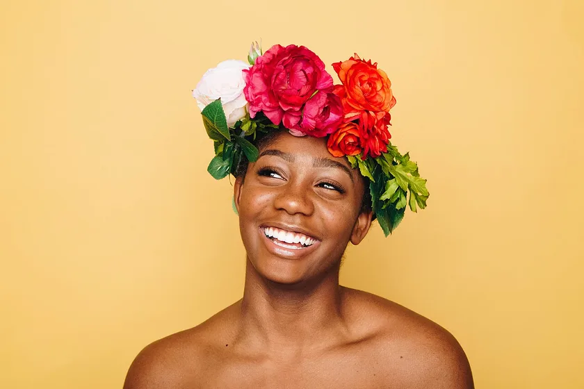 Example portrait for background removal: a smiling woman in a flower crown